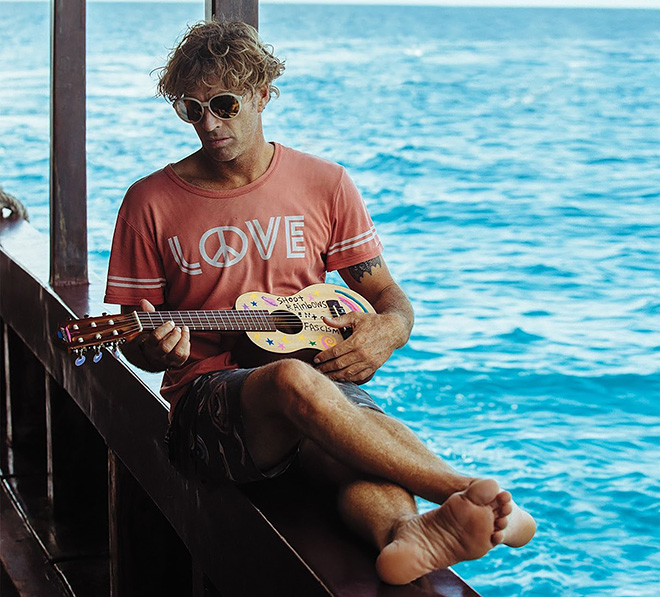 Surfer Ozzy Wright Playing Guitar